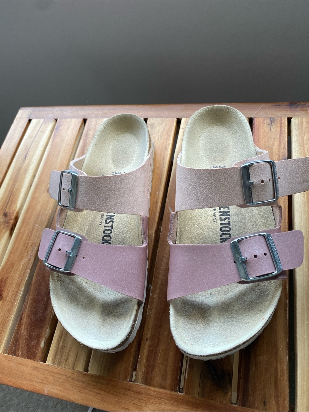 Birkenstock Arizona sandals in two shades of pink.